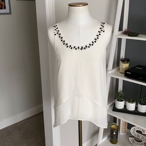 White sleeveless top